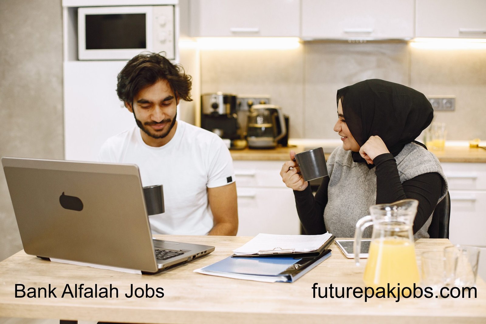 beautiful young couple using laptop writing notebook sitting kitchen home arab girl wearing black hidjab 1 scaled